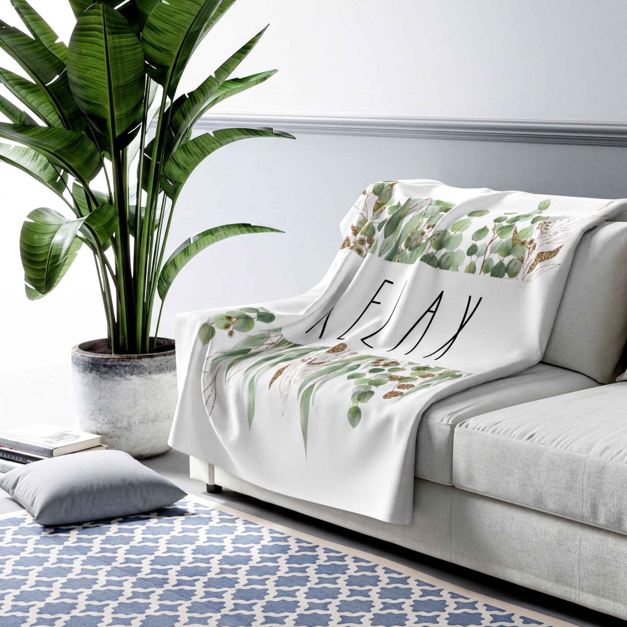 Rae Dunn Inspired RELAX Eucalyptus Leaves Blanket on a bed