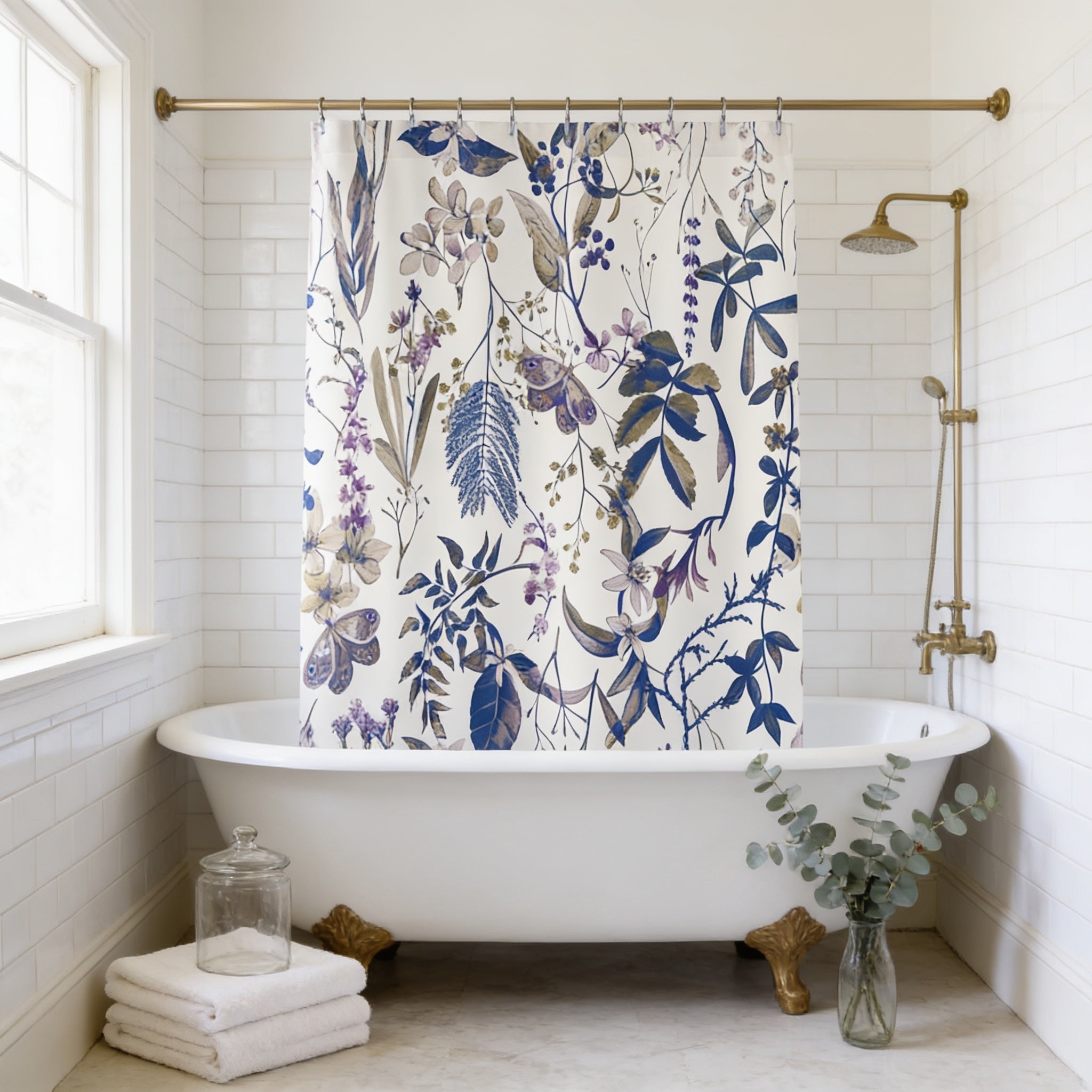 a bathroom with a white clawfoot bathtub, a shower curtain with a floral pattern, and a vase of greenery on the floor.