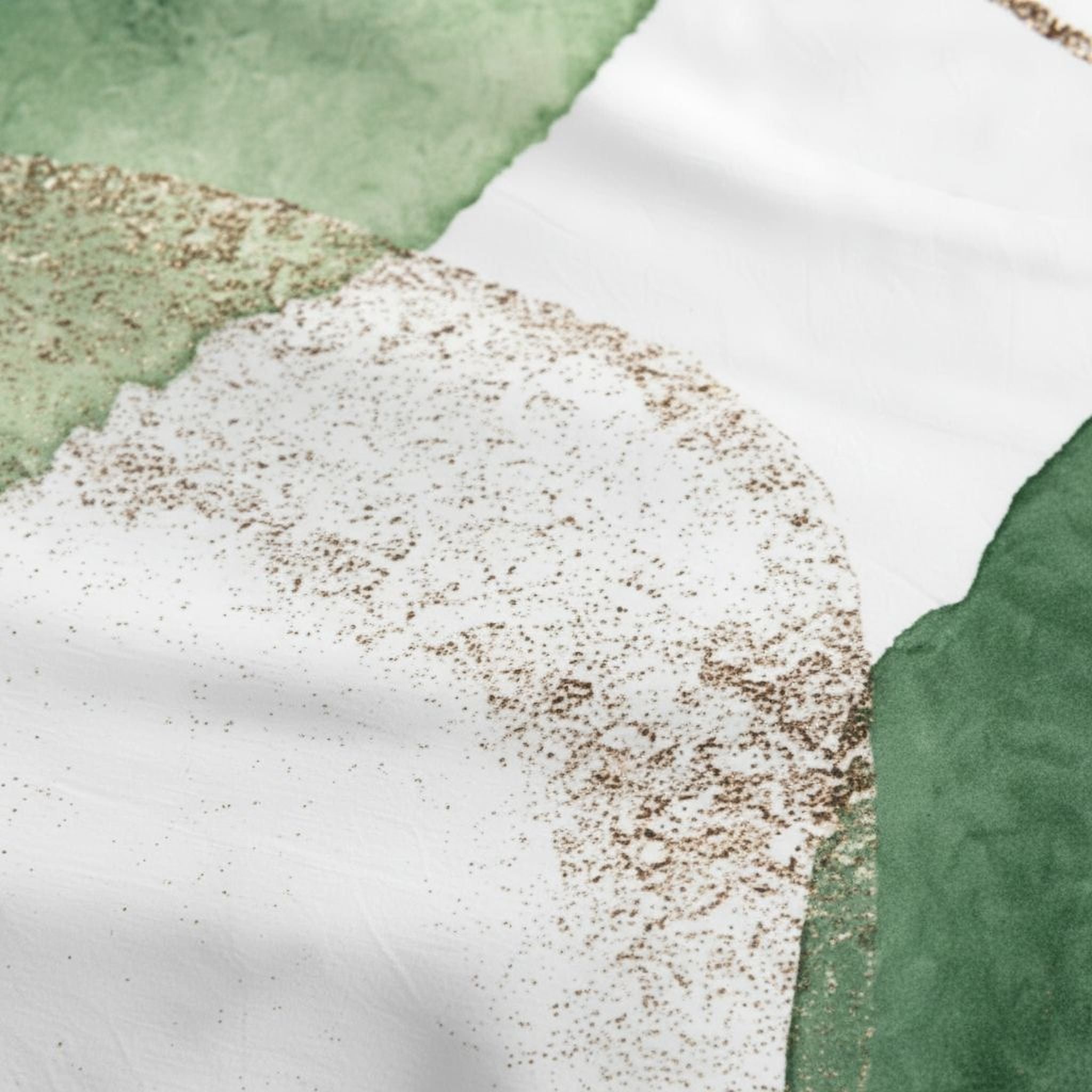 The image is a close-up of a white fabric with a pattern of brown specks or specks of color on it.