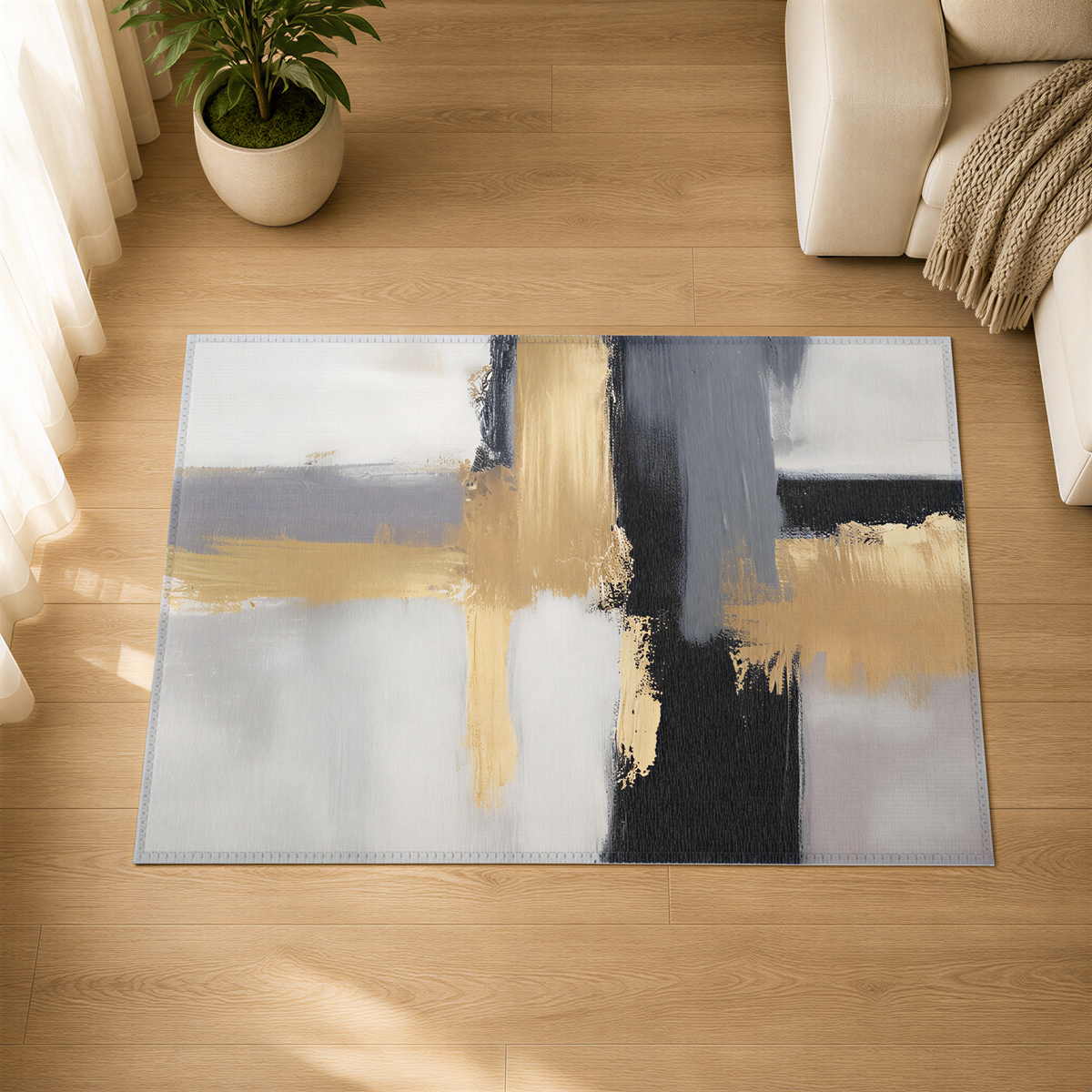 a large abstract rug with a mix of blue, gray, and gold colors, placed on a wooden floor in a living room setting.