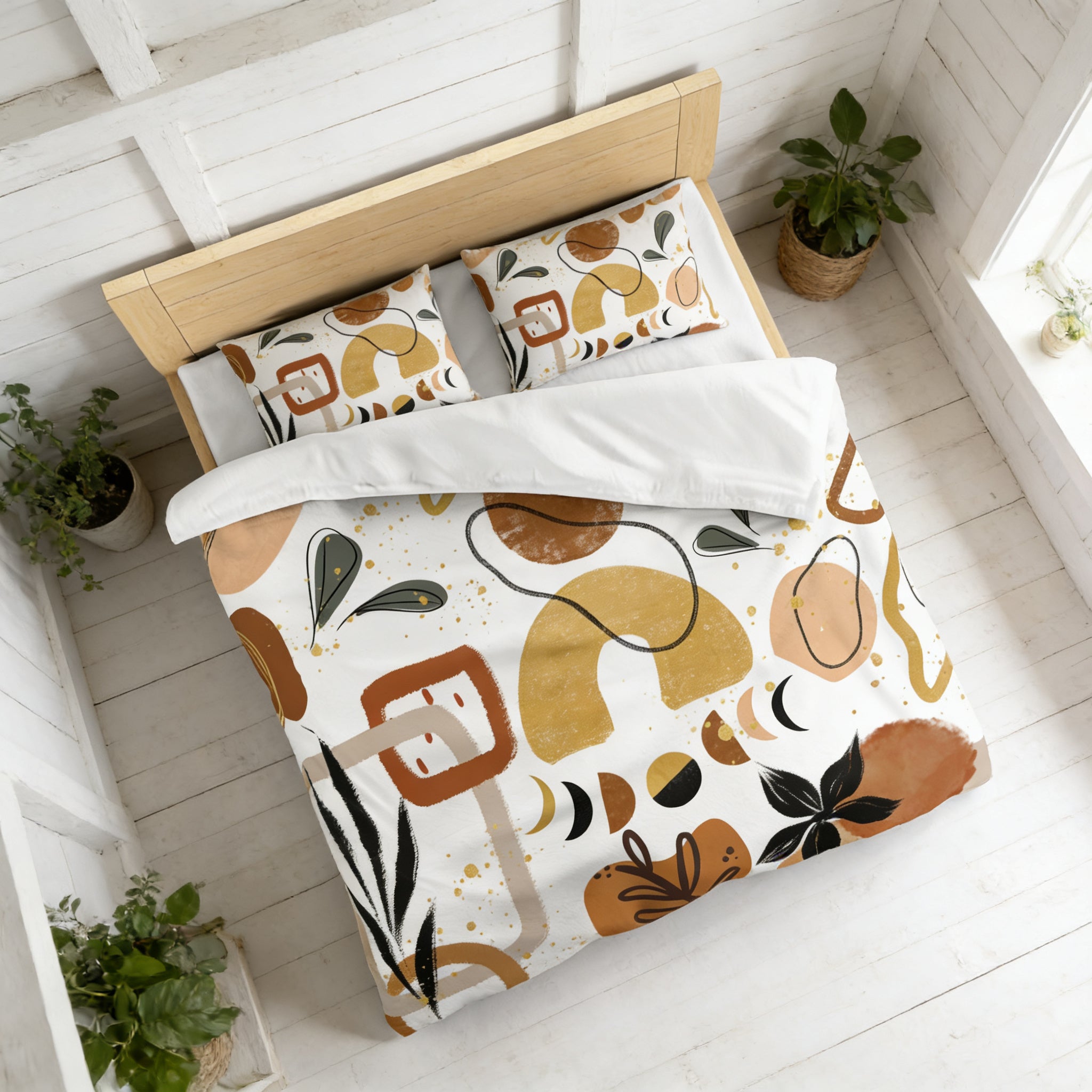a bedroom with a bed covered in a colorful, abstract patterned comforter and pillows. The bed is positioned against a white wall, and there are two potted plants on either side of the bed.