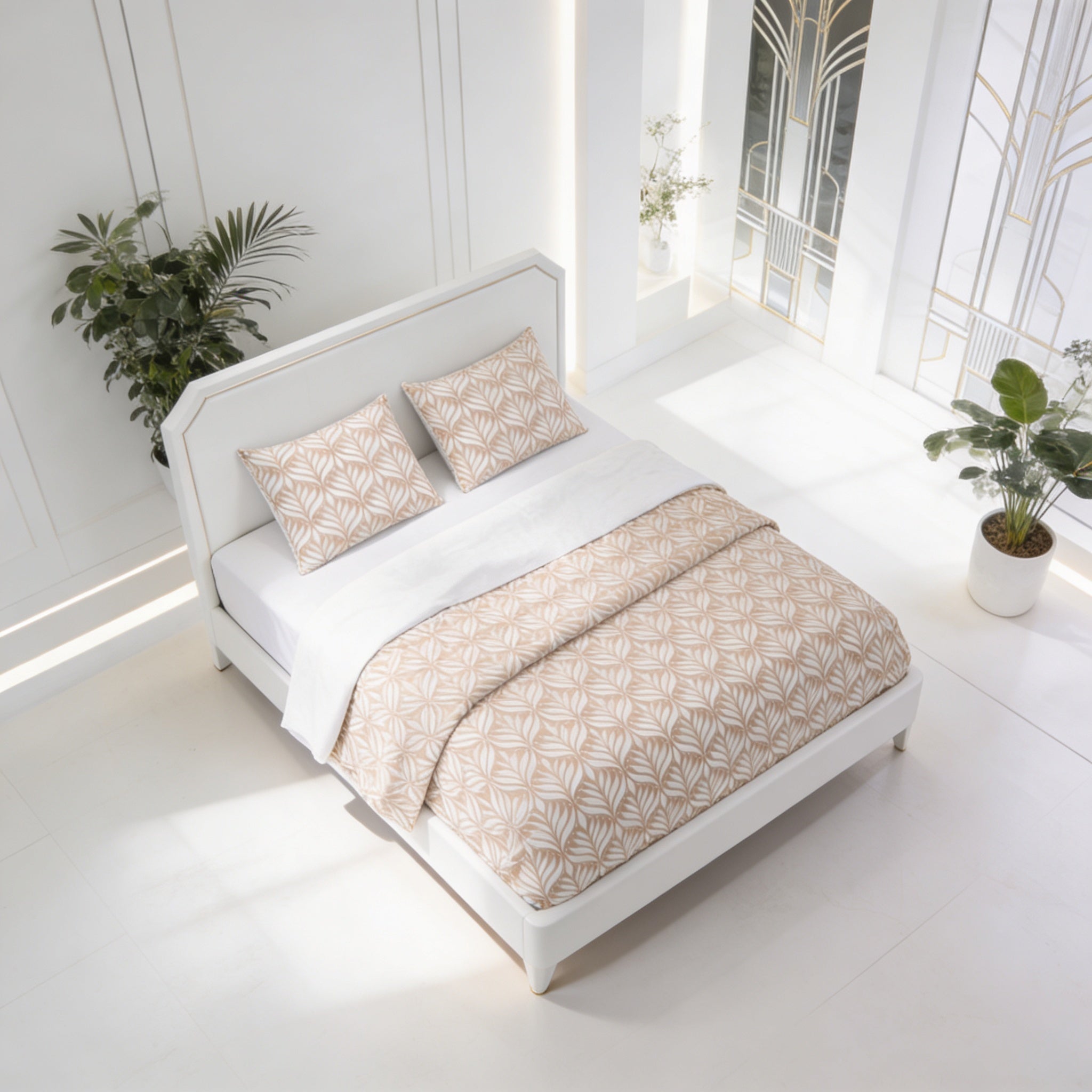 a white bed with a patterned bedspread and pillows, placed in a bright, white-walled room with a window and potted plants.