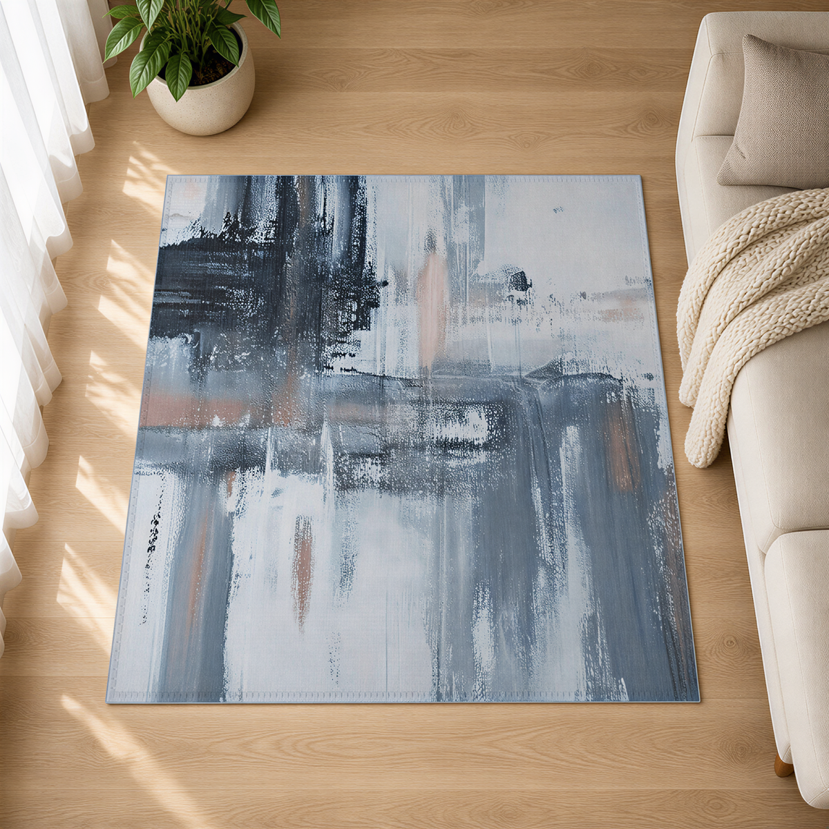 a large abstract painting with a mix of blue, white, and gray colors, displayed on a rug in a living room setting.