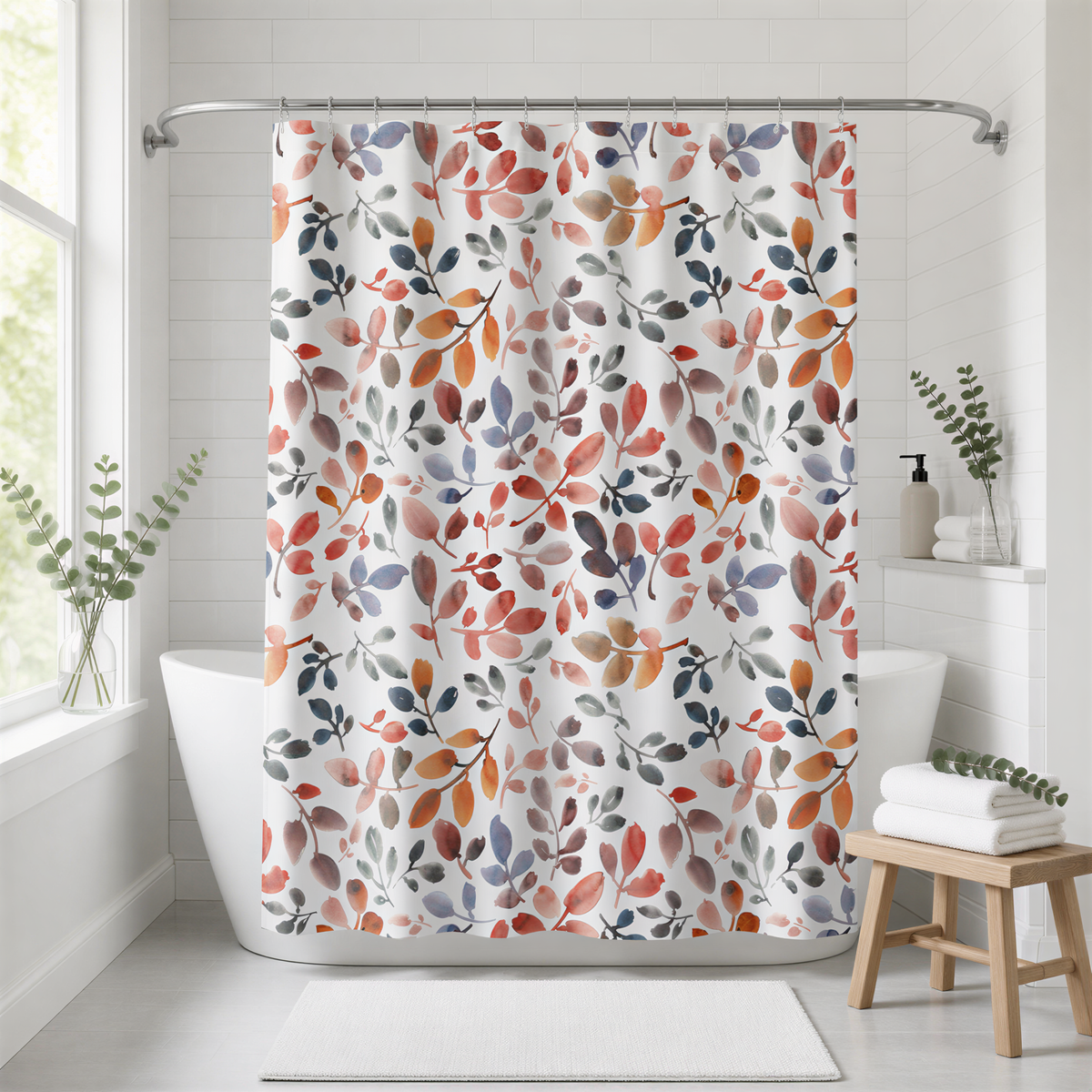 a bathroom with a shower curtain adorned with a colorful leaf pattern in shades of orange, red, and green. The shower curtain is hanging from a rod above a white bathtub. The bathroom also includes a wooden stool, a white rug, and some potted plants, creating a cozy and inviting atmosphere.
