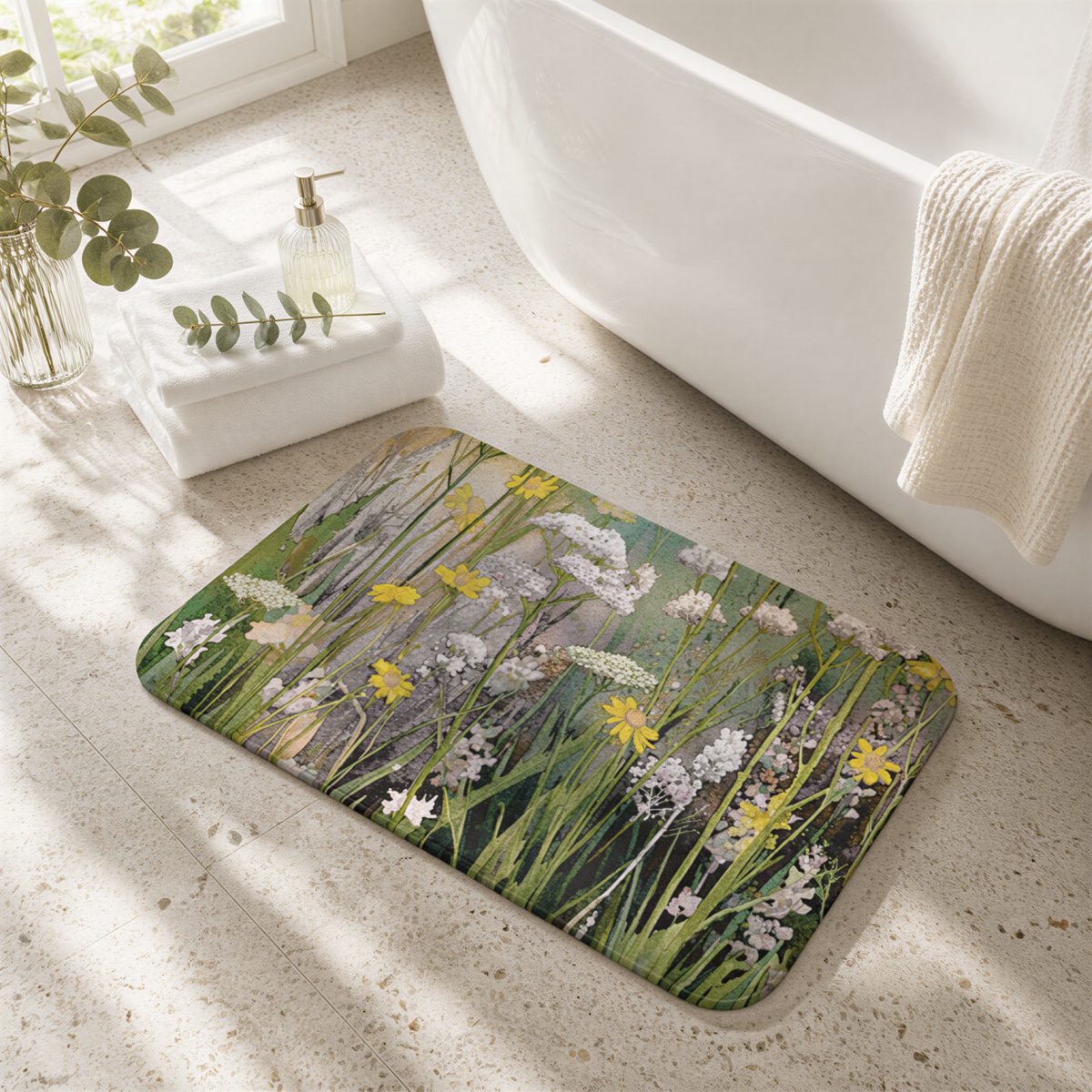 a bathroom with a green and white floral patterned bath mat on the floor, a white bathtub, and a white towel hanging on a rack.