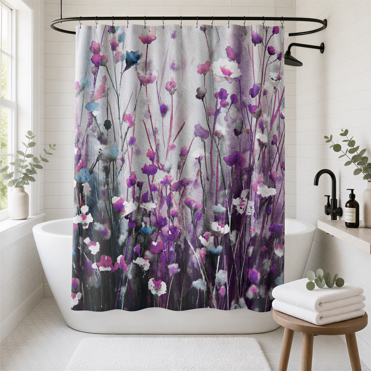 a bathroom with a shower curtain that has a floral design in shades of purple and pink. The shower curtain is hanging from a rod above a white bathtub. The bathroom also includes a wooden stool, a potted plant, and a bottle of soap.