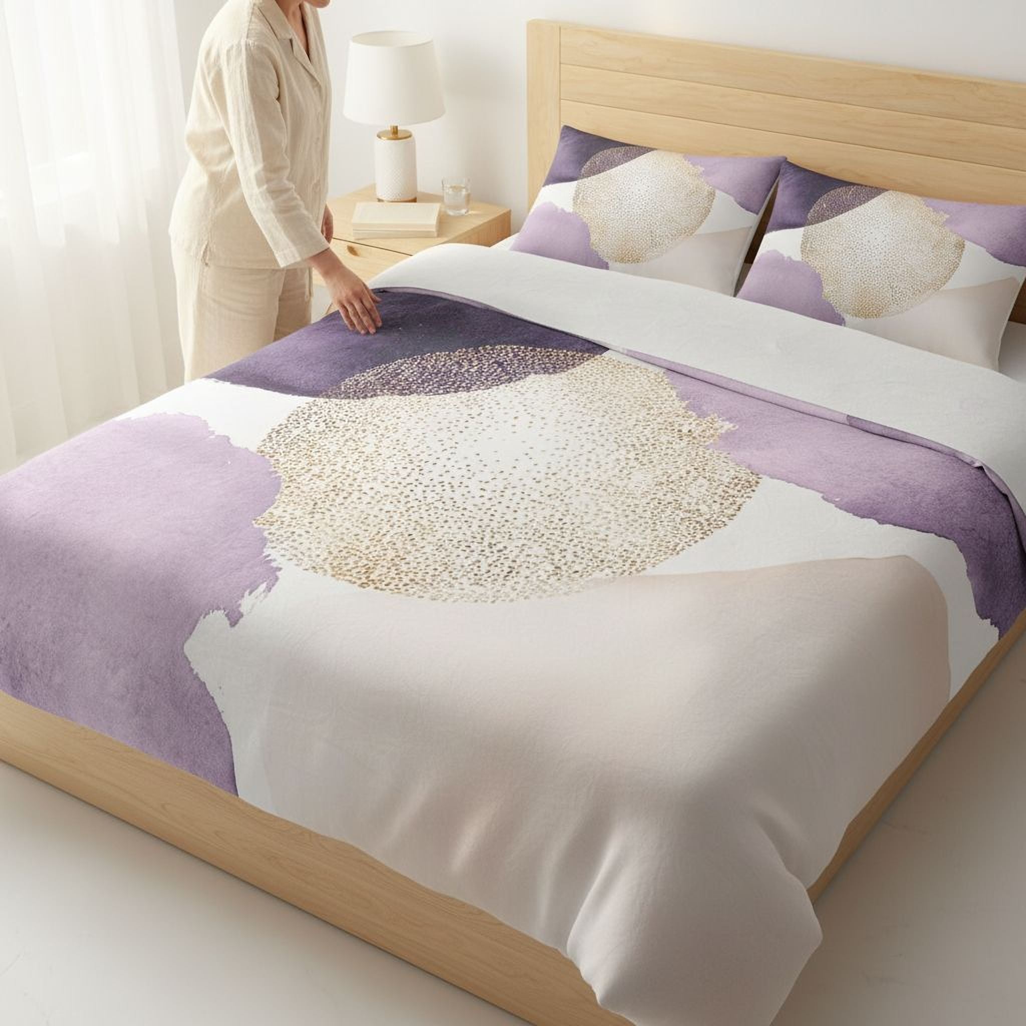 A person is standing next to a bed with a purple and white bedspread featuring a gold and white abstract design.