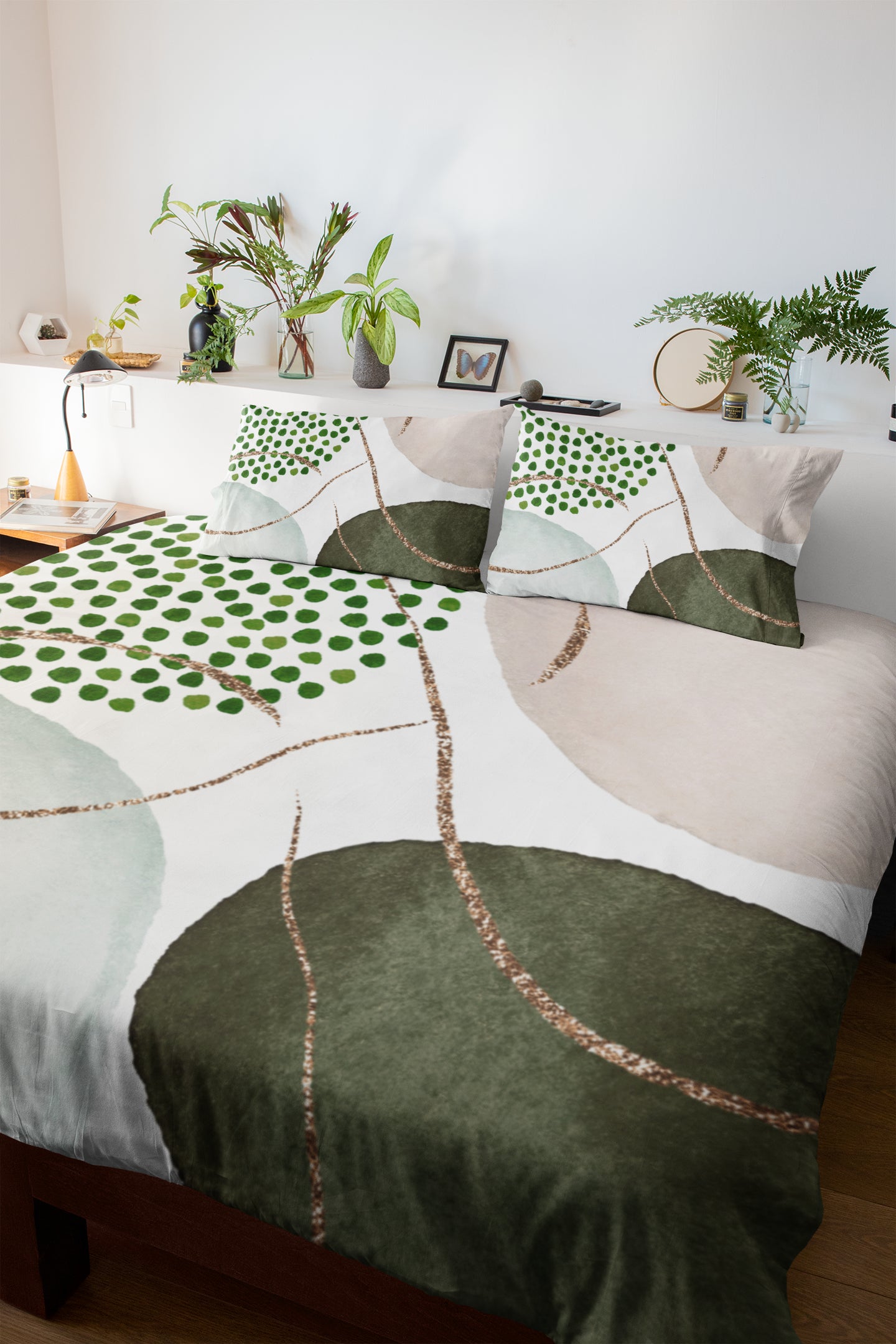 a bed with a green and white comforter on top of it