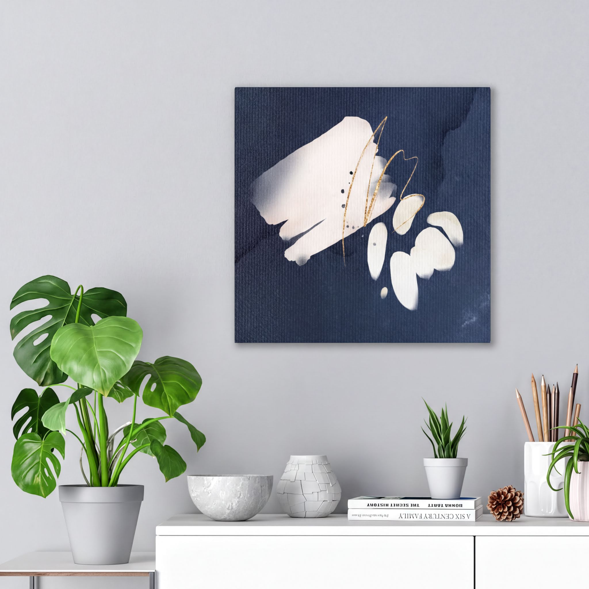 Navy blue, cream and white abstract wall canvas art styled in a modern interior