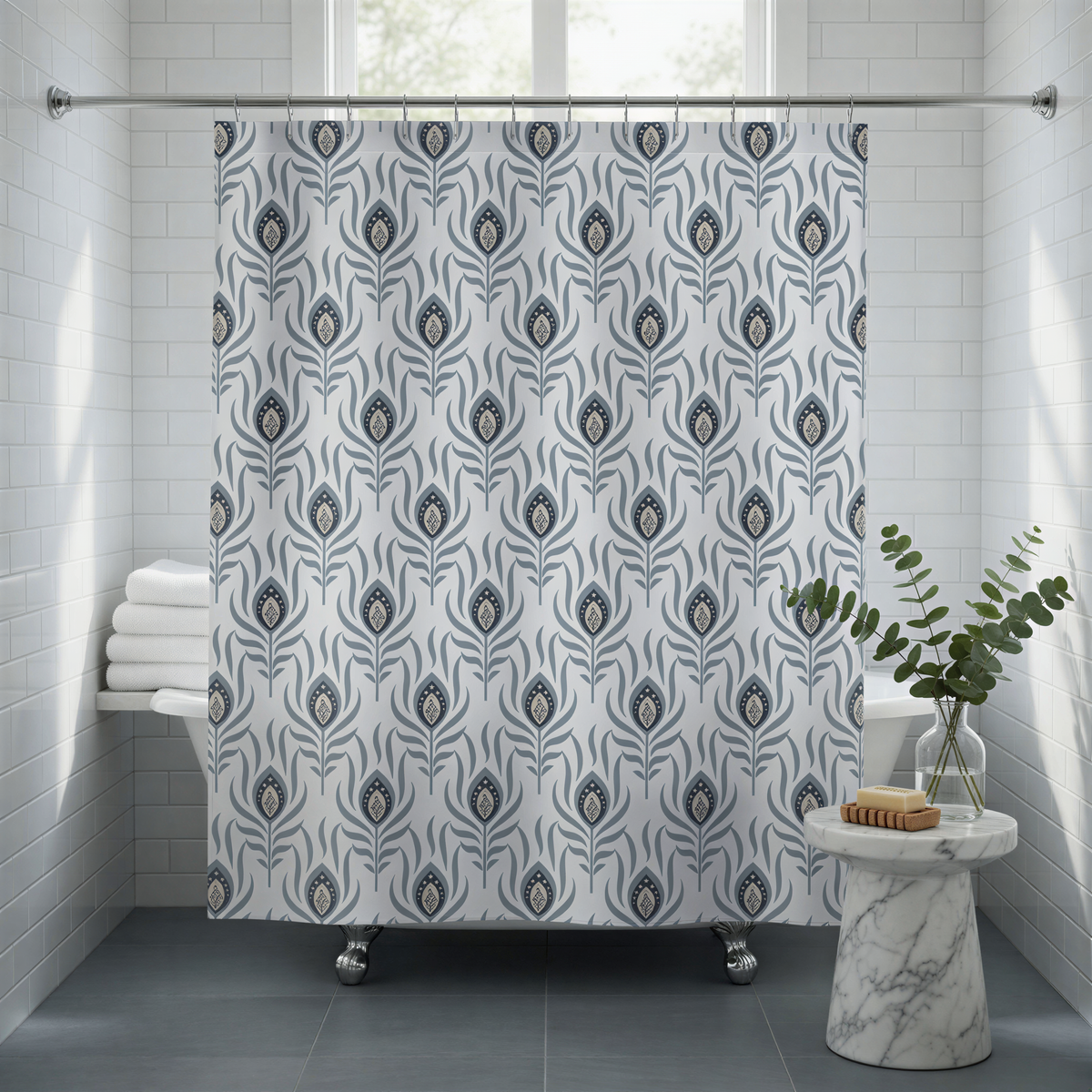 a bathroom with a shower curtain adorned with a repeating pattern of blue and white peacock feathers. The shower curtain is hanging from a rod, and there is a small table with a plant and a soap dispenser placed next to it.