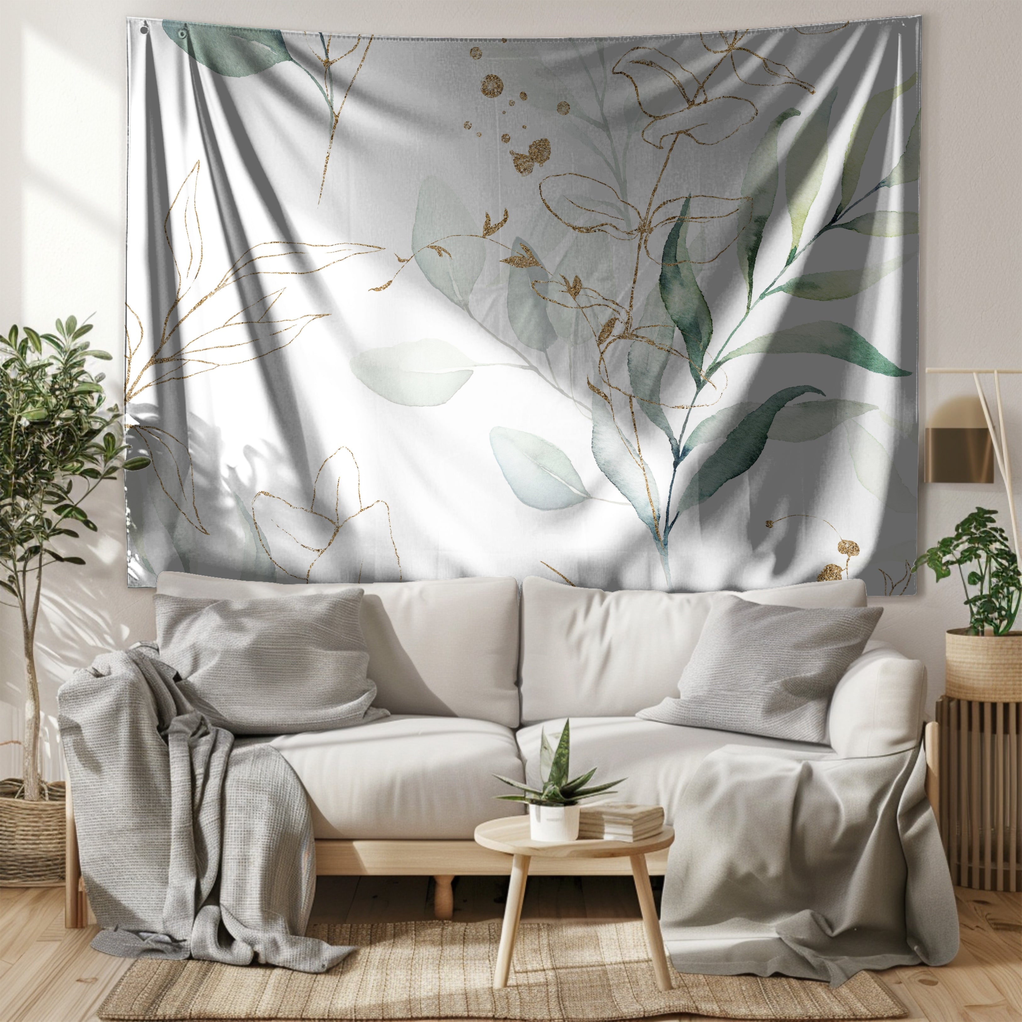 a living room with a white sofa, a coffee table, and a large tapestry hanging on the wall behind the sofa.
