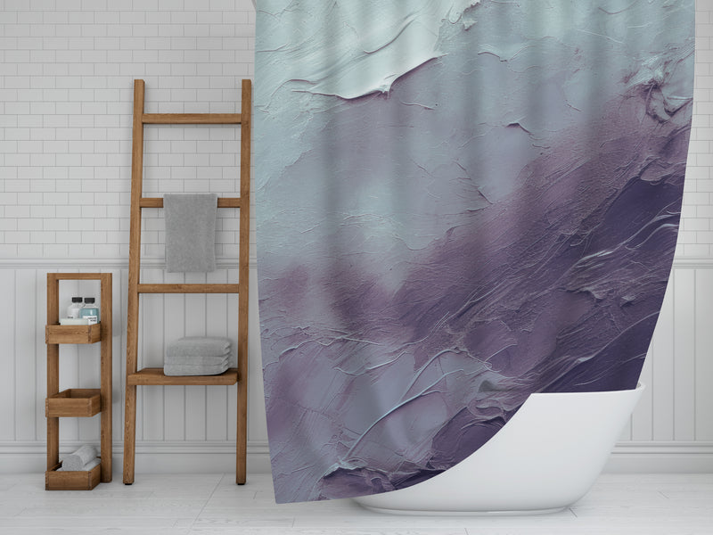 a bathroom with a shower curtain with a painting on it